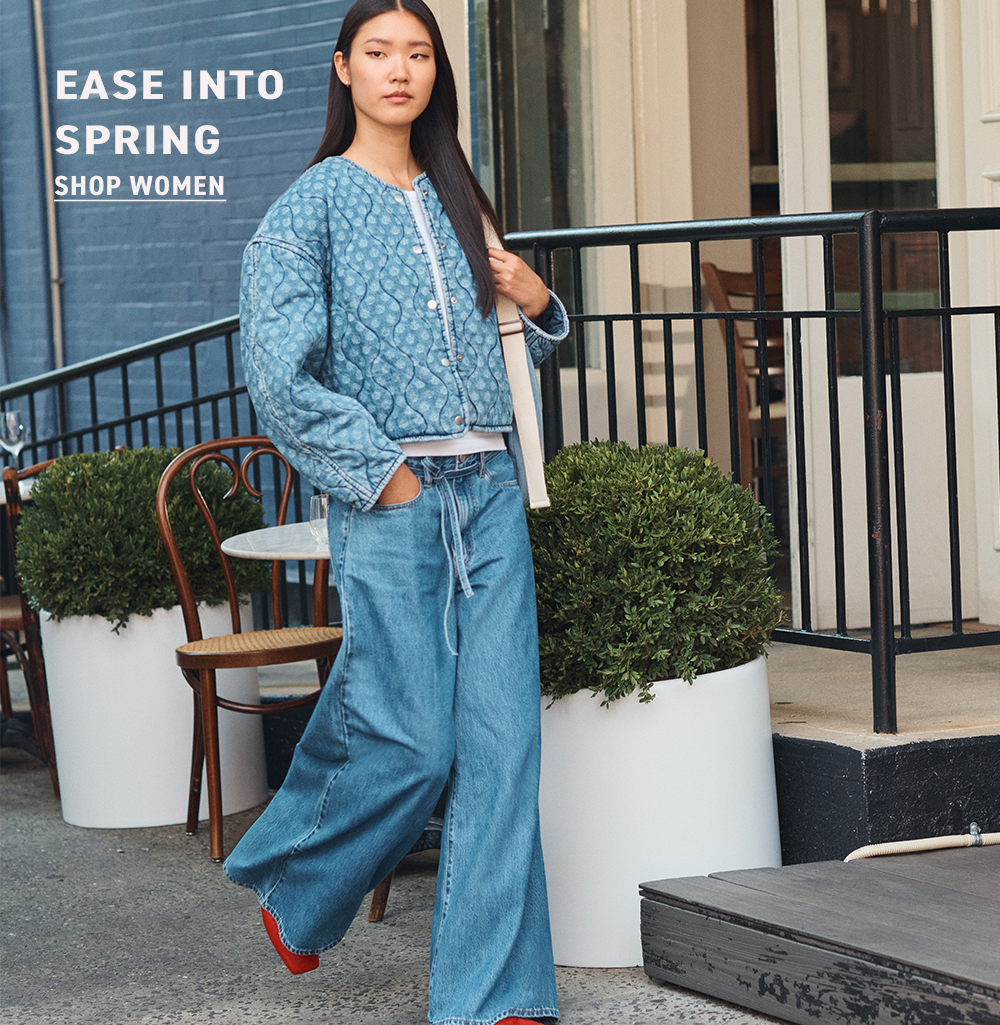 A young woman wearing a white blouse, green jacket, and wide-leg denim jeans - Levi's Hong Kong